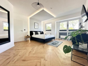 Modern Apartment - für Freunde & Familien, stadtnah, Parkplatz, E-Ladestation, Gitterbox für Fahrräder, Fitnessstudio, digitale Gästemappe mit Restaurant- und Unternehmenstipps